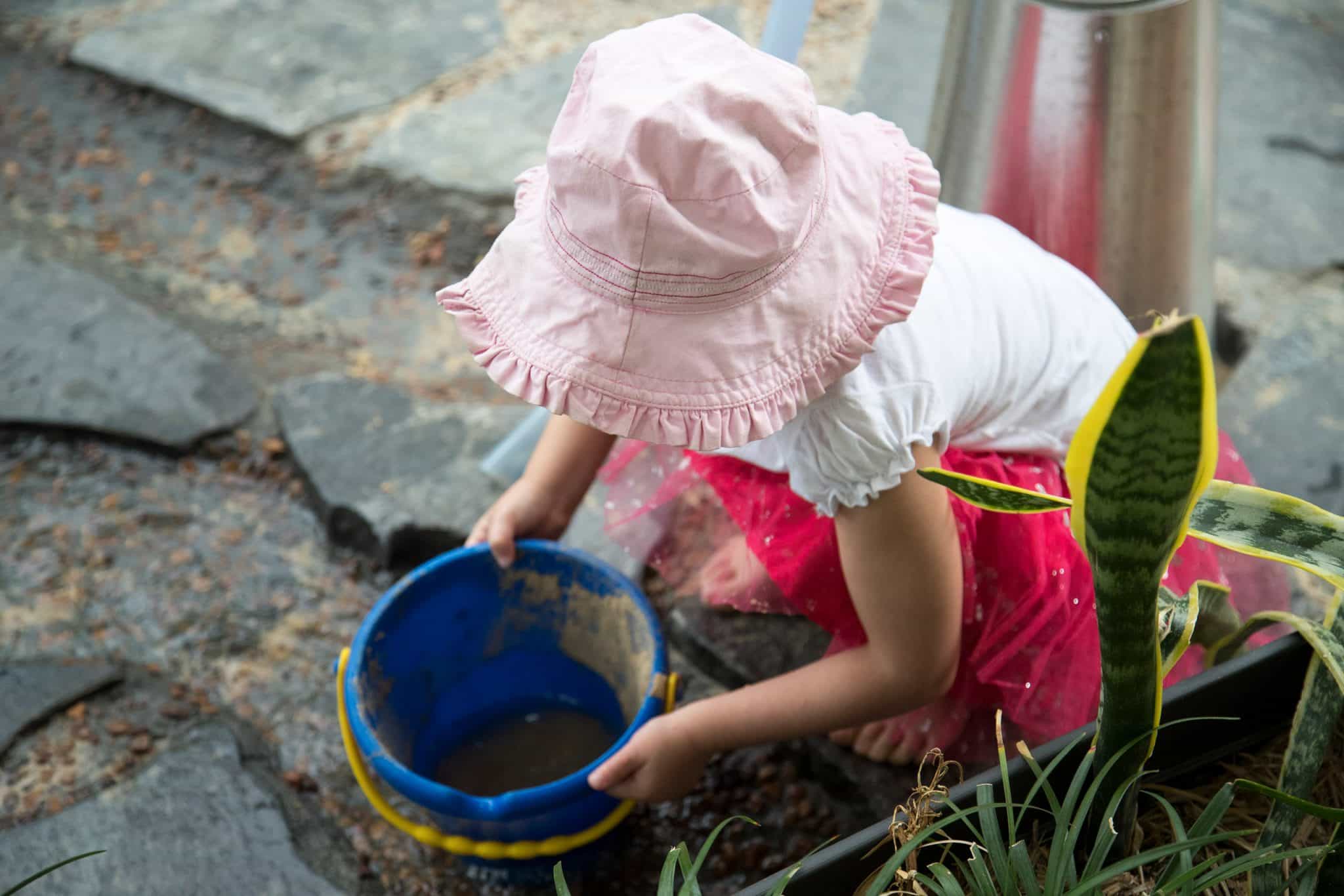 Playing with the water feature at Kindalin Frenchs Forest
