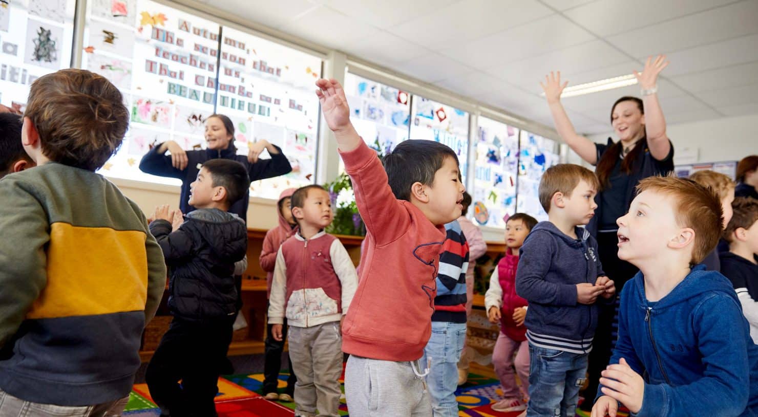 Children dance joyously during Calendar Time at Kindalin Castle HIll